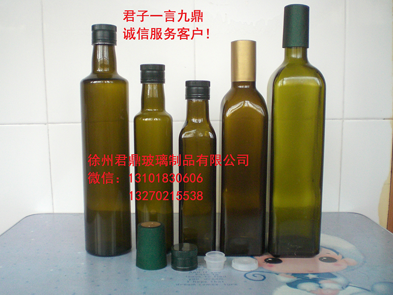 In stock supply of dark green olive oil red wine bottles